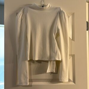 Off-white open back crop top with long sleeves